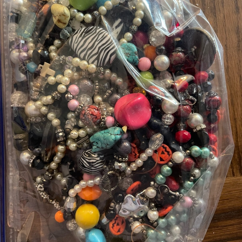 Bag of homemade necklace some loose beads